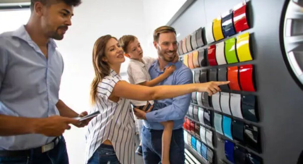 Family Choosing Car Colour at a Dealership