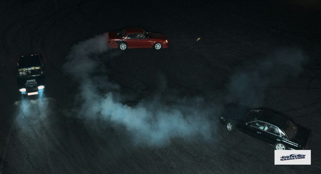 Black and Red Cars Showing Dust and Water Spots